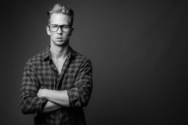 istock Studio shot of young handsome hipster man in black and white 1330396366