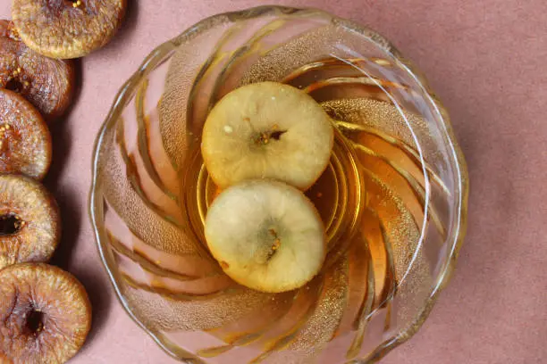Close-up of dried figs and figs soaked in water overnight