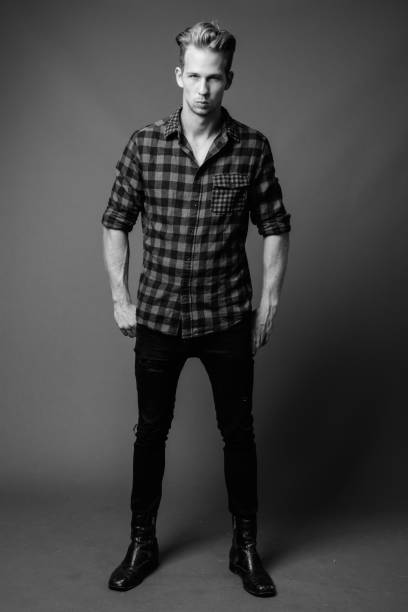 istock Studio shot of young handsome hipster man in black and white 1330396413