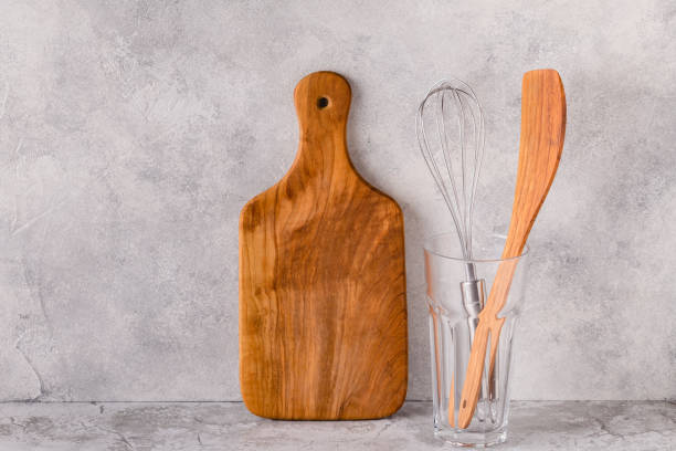 istock Kitchen utensils for eating and cooking on a light table 1330396870