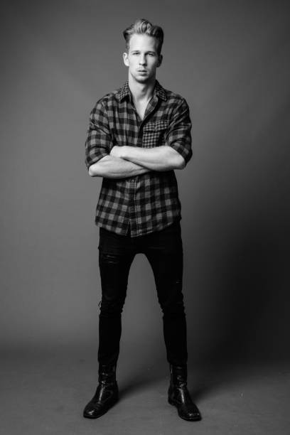 istock Studio shot of young handsome hipster man in black and white 1330397580