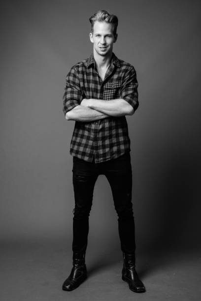 istock Studio shot of young handsome hipster man in black and white 1330397592