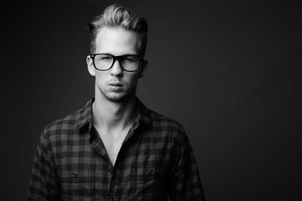 istock Studio shot of young handsome hipster man in black and white 1330397619