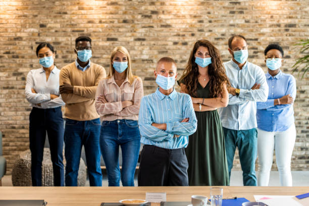 istock Group of business persons with face masks 1330401083