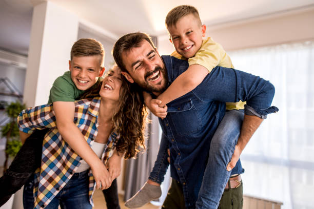 istock Young family having fun at home. 1330402104