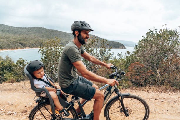 istock father on the ebike with the son 1330403471