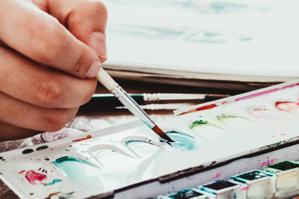 istock watercolor palette on wooden table 1330405844