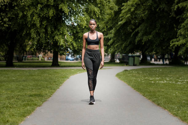 istock Black young woman doing exercise in a park. 1330406671