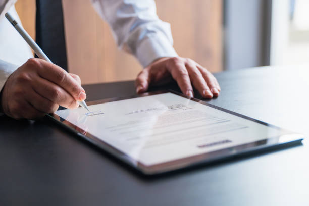 istock Man Signing The Digital Contract 1330417930