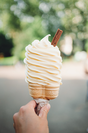 Close up shot of an ice cream holding by hand