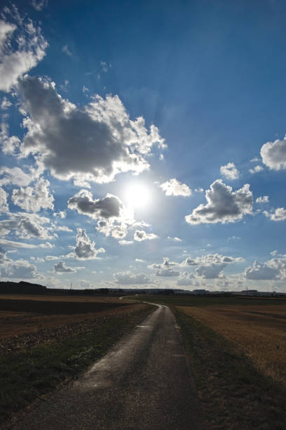 Spring on meadow. Fresh grass and beautiful clouds