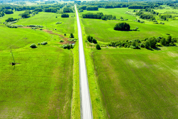 istock Highway through fields and arable land. View from above. Summer rural landscape 1330422082