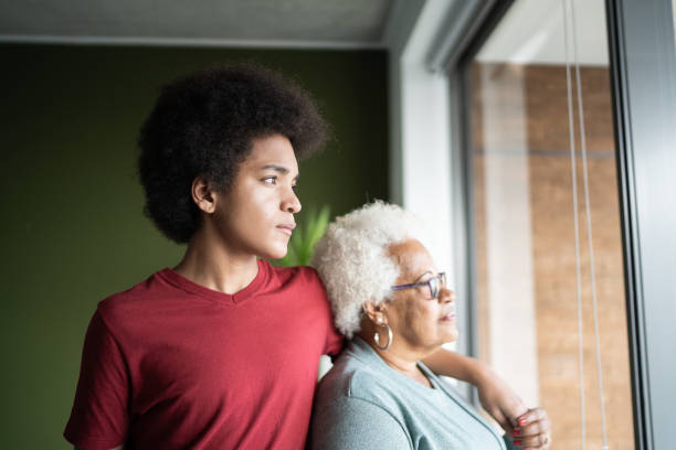 Grandmother and grandson contemplating at home