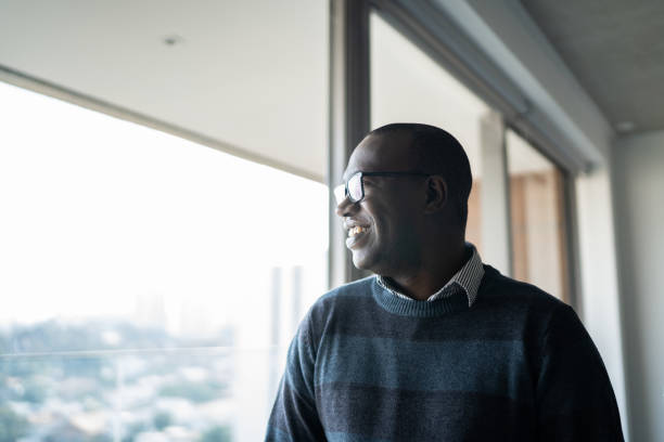 istock Mature man contemplating at home 1330426163