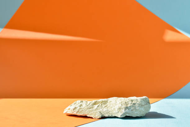 the podium is an orange-blue background with a stage, a showcase made of stone and a minimalistic background. presentation of cosmetics. - construction platform wood nature contemporary imagens e fotografias de stock