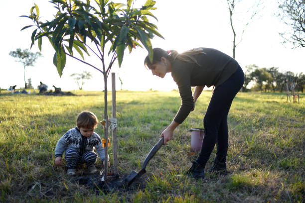 istock mother with child working in the garden 1330433280