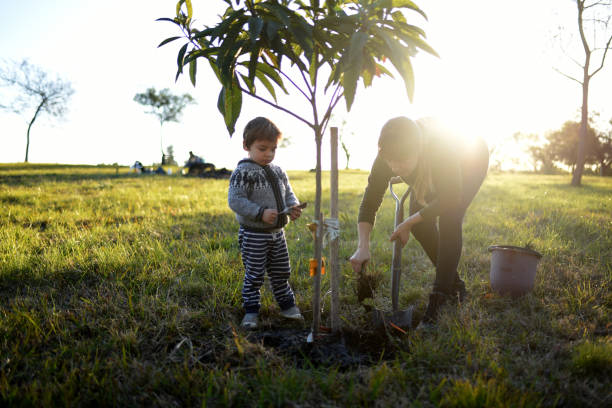 istock mother with child working in the garden 1330433930