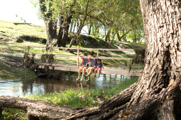 istock mother walking outdoors with children 1330434158