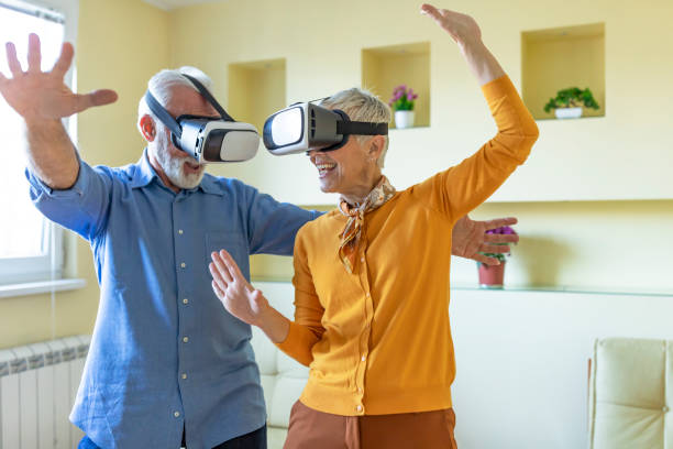 istock A Couple of Retirees is Gesturing and Smiling While Playing a Games on VR System. 1330441259