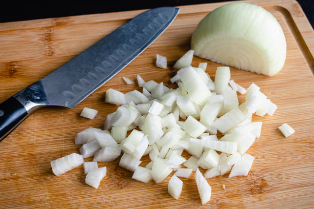 istock Diced Onion on a Bamboo Cutting Board 1330441297