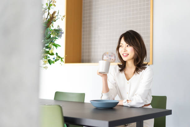 istock Young woman drinking coffee in a cafe 1330443734