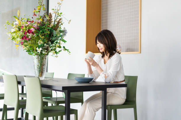 istock Young woman drinking coffee in a cafe 1330443743