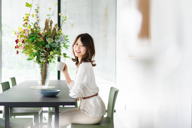 istock Young woman drinking coffee in a cafe 1330443751
