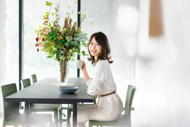 istock Young woman drinking coffee in a cafe 1330443752