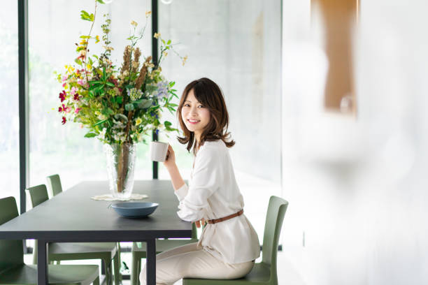 istock Young woman drinking coffee in a cafe 1330443756