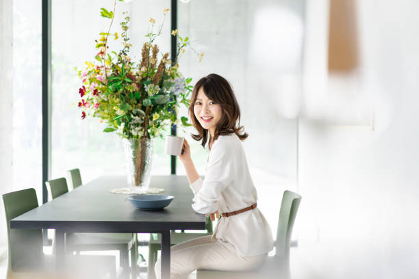 istock Young woman drinking coffee in a cafe 1330443757