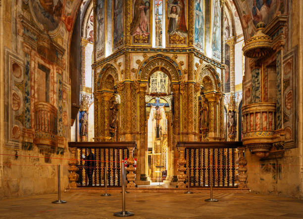 View of the Charola at the Convento de Cristo in Tomar, Portugal, with the entrance in the foreground. Tomar, Portugal - June 3, 2021: The entrance to Charola was facing east, and during the works of King D. Manuel, the new entrance was made to the south, in the nave that extended the oratory to the west, with a grandiose triumphal arch. The new portal was the work of João de Castilho. convento stock pictures, royalty-free photos & images