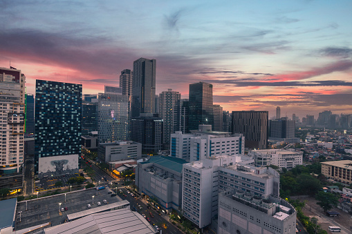 Bonifacio Global City, Taguig, Philippines - April 2021: Sunset scene of the BGC skyline. St Lukes Hospital in the lower right of photo.
