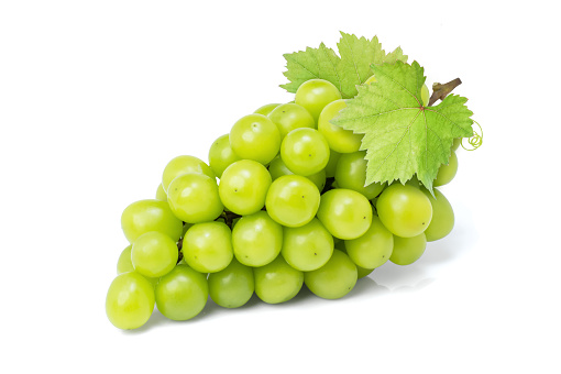 Green grape with leaf isolated on white background. Full depth of field.