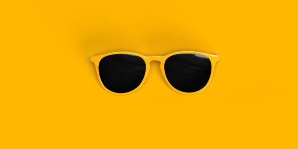 istock One retro style sunglass with dark colored lens on yellow background. 1330477567