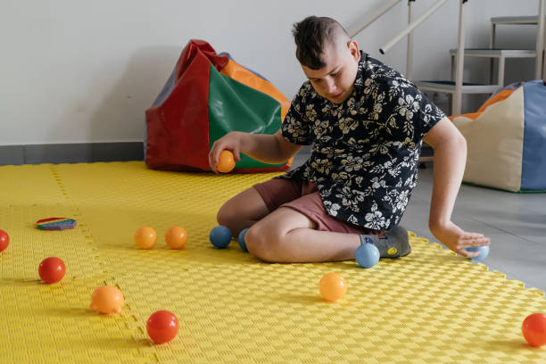 istock disabled child doing sensory activity with toys, rehabilitation 1330481622