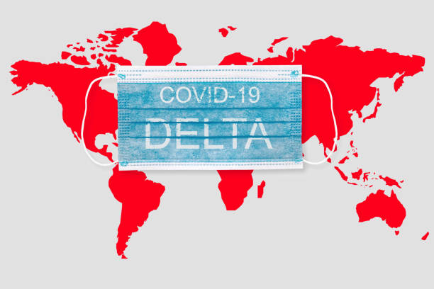 istock Face mask with world map and inscription COVID 19 DELTA . Covid 19 delta variant outbreak around the world 1330482746