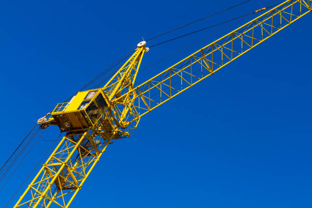 istock High yellow construction crane against the blue cloudless sky 1330485140