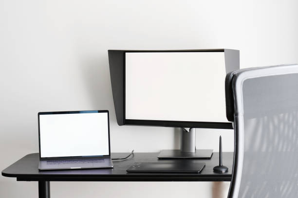 istock Table with laptop and monitor 1330489637