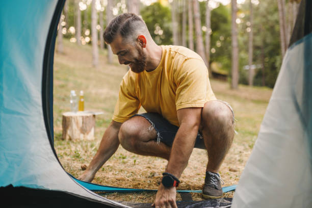 istock Happy man enjoying in camping 1330490995