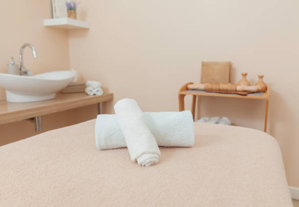 istock Spa towels on a couch in a beauty salon 1330491499