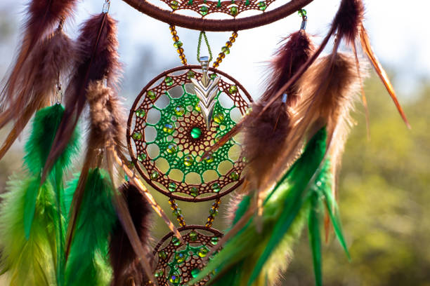 istock Handmade dream catcher with feathers threads and beads rope hanging 1330492653
