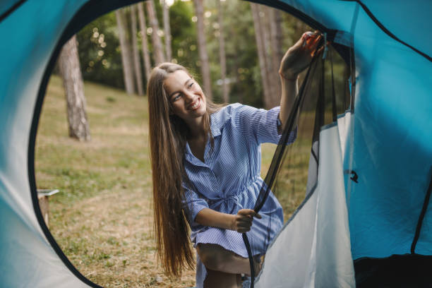 istock Beautiful young woman enjoying in camping 1330493956