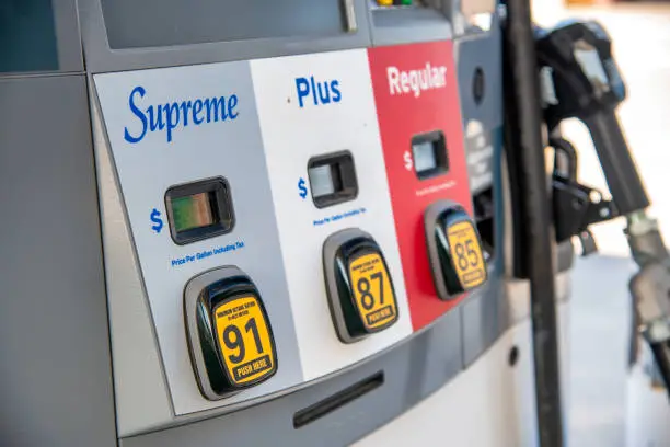 Photo of Supreme, Plus, Regular gasoline at gas station pump.