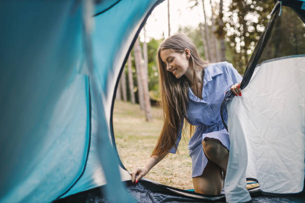 istock Beautiful young woman enjoying in camping 1330496550