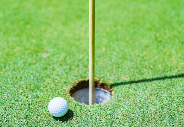 istock golf ball is near pin 1330499294