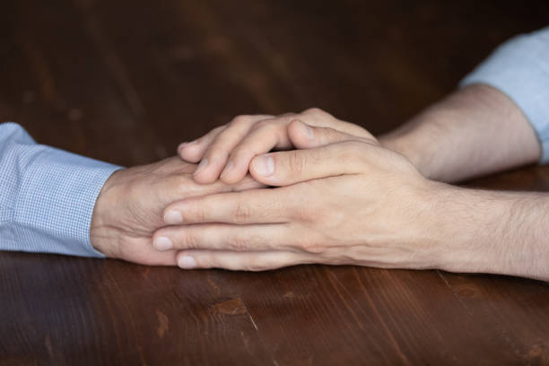 istock Grown son comforting, consoling mature father at difficult moment 1330499338
