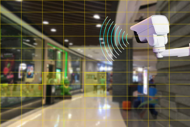 istock Technician installed wireless CCTV  infrared camera by screwdriver technology 4.0 for look security area of work in shopping mall  show signage with security customers in area. 1330504068