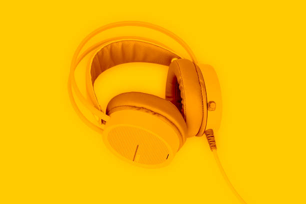 istock Yellow headphone on yellow background. 1330505363