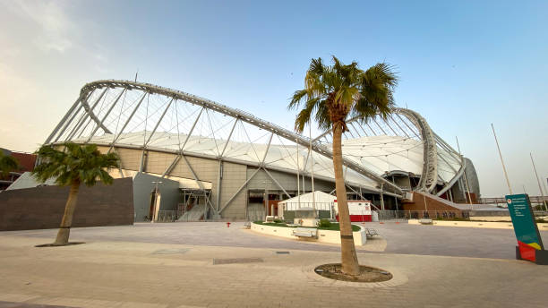 façade of khalifa international stadium against blue sky - qatar football stockfoto's en -beelden