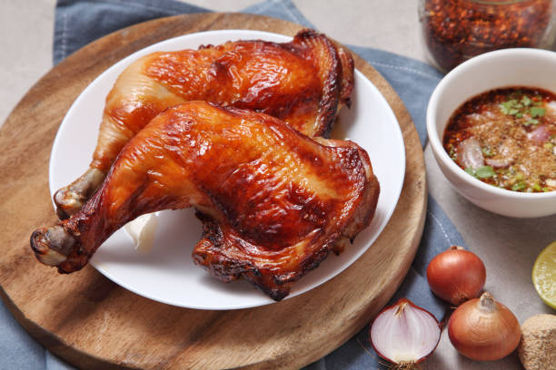 istock Thai style grilled chicken with chili sauce in ceramic dish on loft kitchen 1330506865